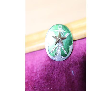 A unusual Japanese Second World War period enamel badge 