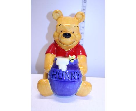 A large Disney Winnie the Pooh ceramic money box 