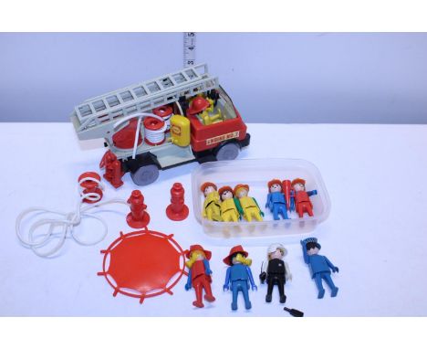 A vintage Playmobil figure engine and figures 