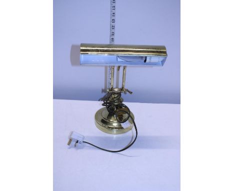 A brass bankers style desk lamp 
