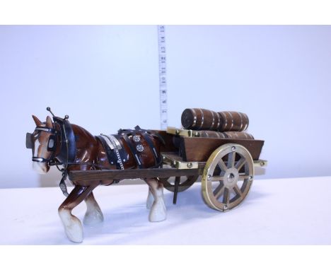 A ceramic shire horse and Draymon's wagon 