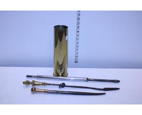 Three vintage pokers in a WW2 British brass shell 