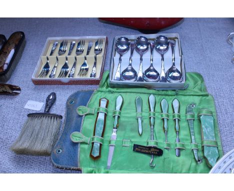 A selection of vintage cutlery and manicure set with hallmarked silver brush 