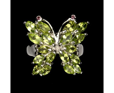 A 925 silver butterfly shaped ring set with marquise cut peridots and garnets, (P).