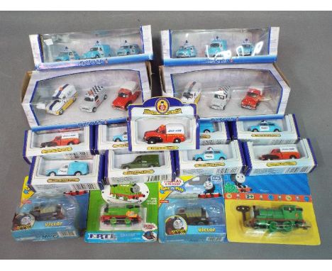 Oxford Diecast, Ertl, Fisher Price - 17 boxed diecast and plastic vehicles in various scales. Lot includes Oxford Diecast Pol
