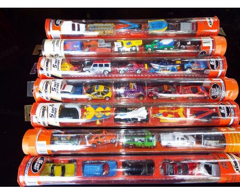 Matchbox Mattel Wheels - seven sealed tubes containing  five model motor vehicles, appear mint