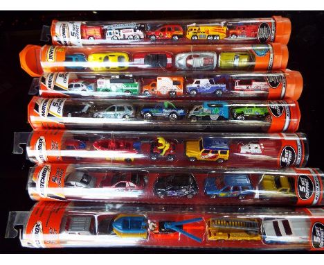 Matchbox Mattel Wheels - seven sealed tubes containing  five model motor vehicles, appear mint