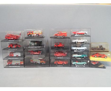 A collection of diecast models contained in display boxes to include classic American cars by New Ray and models of fire appl