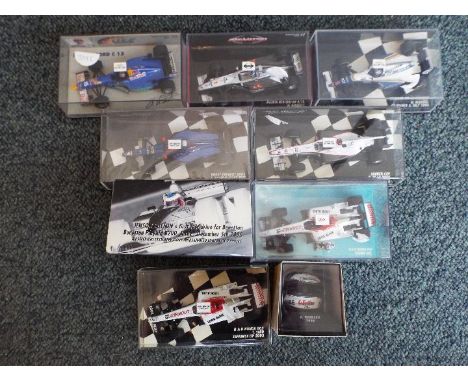 Minichamps - A collection of 8 F1 diecast model racing cars in 1:43 scale plus a 1:8 scale Keke Rosberg 1995 racing helmet by