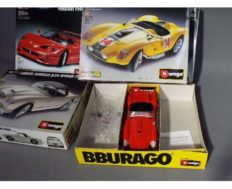 Bburago - Four 1:18 scale diecast model kits by Bburago. lot consists of #7052 Ferrari F50; # 7030 Dodge Viper GTS; #7027 Fer