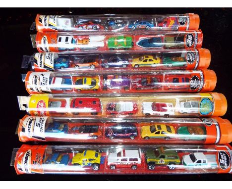 Matchbox Mattel Wheels - seven sealed tubes containing  five model motor vehicles, appear mint