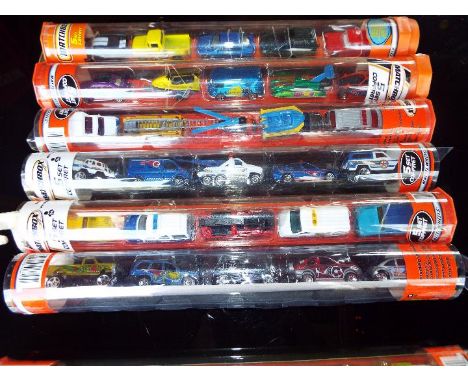 Matchbox Mattel Wheels - seven sealed tubes containing  five model motor vehicles, appear mint