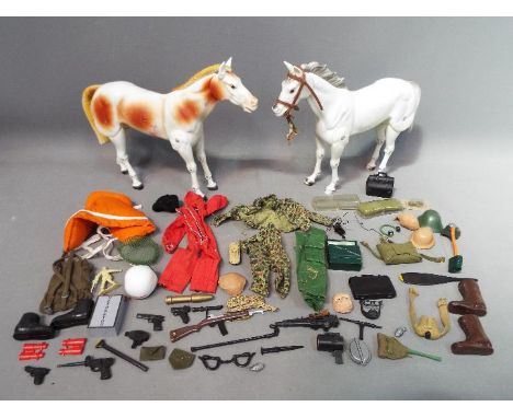 Two 1973 Gabriel 'Lone Ranger' horse action figures and a quantity of Action Man and similar weapons and accessories.
