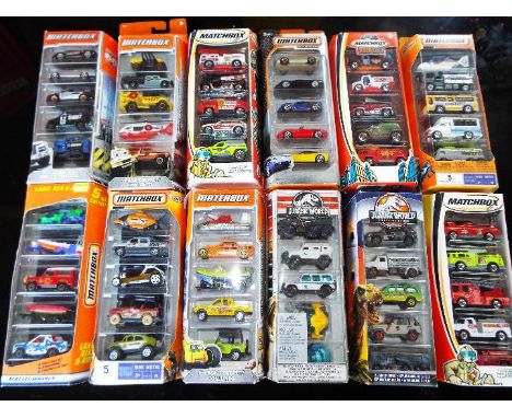 Matchbox - twelve packs each containing five models by Mattel, models mint, slight wear to some window boxes 