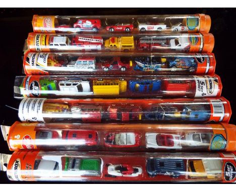 Matchbox Mattel Wheels - seven sealed tubes containing  five model motor vehicles, appear mint