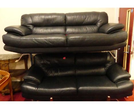 A pair of contemporary navy blue leather upholstered three-seater sofas, each raised on chromed metal angular supports, w.215
