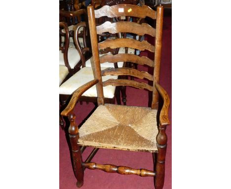 A country elm and rush seat ladder back open elbow chair, width 59cm