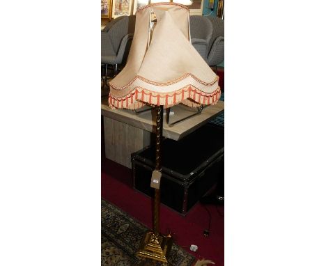 A contemporary polished brass spiral turned standard lamp, h.130cm (excluding fittings)