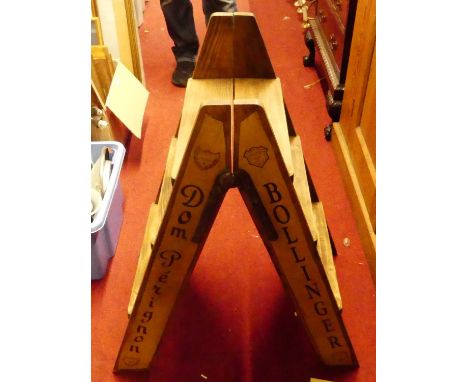 A stained pine A-frame three-tread ladder