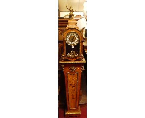 A 20th century Italian walnut, floral inlaid and gilt brass mounted mantel clock, having a glazed trunk door, white enamel in