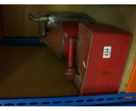 Two vintage parafin cans and a similar petrol can.