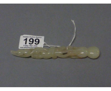 White Jade Carving of a Dragon on Plant