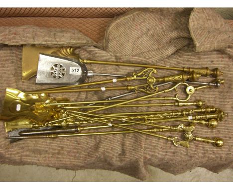 A quantity of antique fire iron tools.