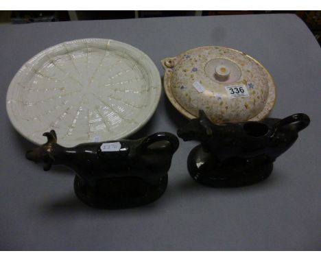Two 19th century Black Glazed Cow Creamers, Royal Worcester Warming Dish specially made for Asprey's and 19th century White G