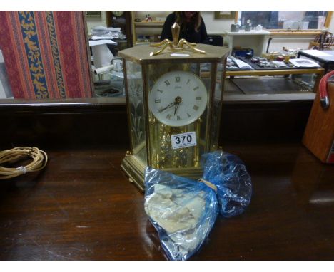 A Kundo cased anniversary clock.