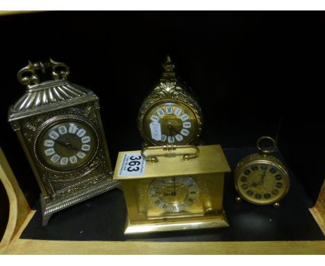 A  small Swiza bracket clock a brass travelling alarm clock and two others