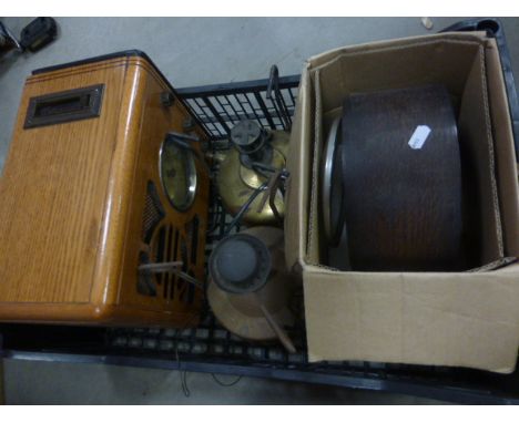 Two vintage brass paraffin lamps, a oak cased mantle clock and a wooden cased radio.