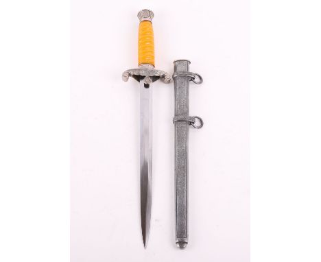 WW2 German Army Officers Dress Dagger, being a fine example with a glass type orange grip. Oakleaf relief to the pommel and f