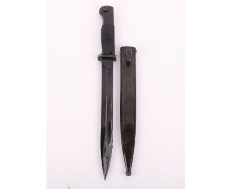 Reproduction WW2 German K98 Bayonet, with two piece grips. Housed in steel scabbard. Un-marked blade with fuller to the back 