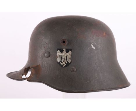 WW2 German / Austrian M-16 Transitional Steel Combat Helmet with Battle Damage, superb example of a transitional pattern stee