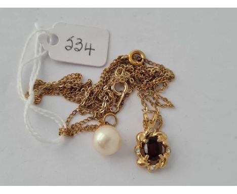 A drop pearl pendant necklace and garnet and white stone pendant necklace