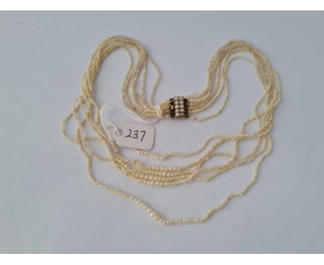A GEORGIAN SIX STRAND NATURAL PEARL AND SEED PEARL NECKLACE SET WITH GEORGIAN CLASP