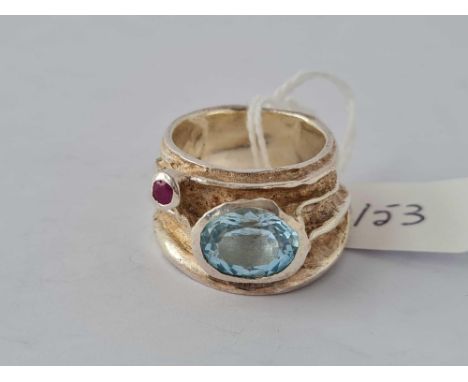 A silver topaz and ruby ring size Q    20 gms