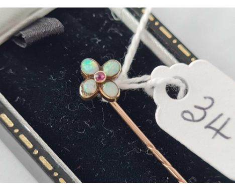 A Victorian opal and ruby stick pin with swivel top in high carat gold on 9ct pin boxed