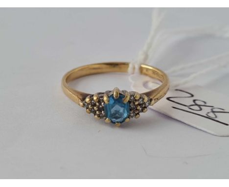A topaz and diamond dress ring 9ct size M   2 gms