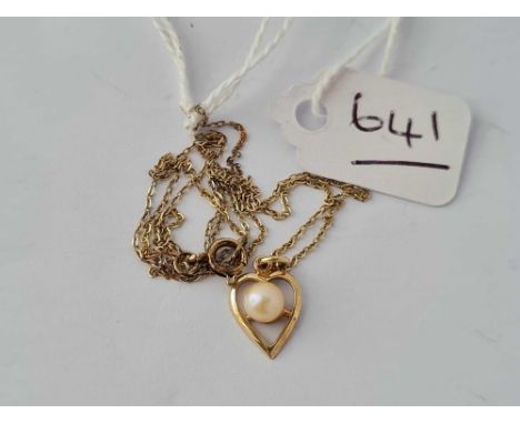 A heart shaped pearl pendant on fine link chain 9ct