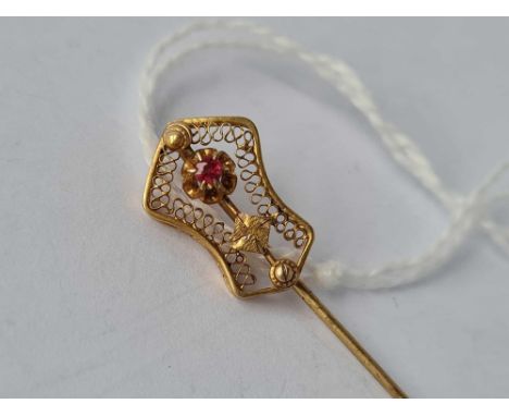 A stick pin 190ct gold with ruby on top