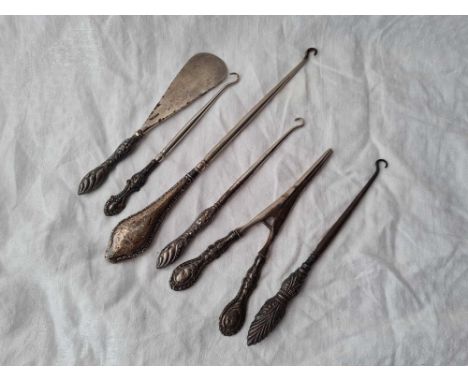 Six silver handled button hooks etc