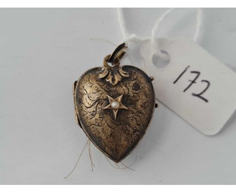 A antique gold locket set with a pearl
