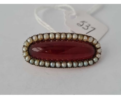 A superb large golden amber and pearl Georgian curved French brooch