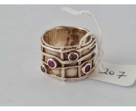 A silver ruby and topaz band ring size Q    11 gms