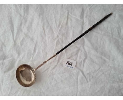 A Georgian toddy ladle with oval crested bowl, whale bone handle
