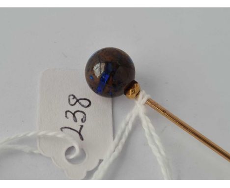 A excellent French marked boulder opal with fiery blue flashes stick pin set gold