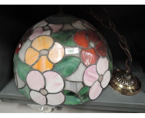 A large ceiling light shade in a tiffany style