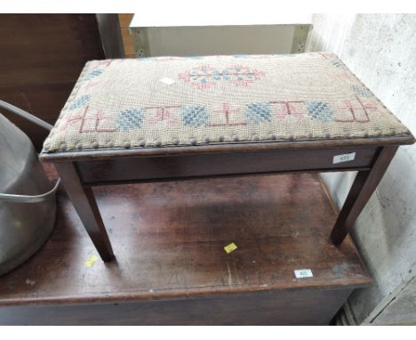 A vintage tapestry footstool