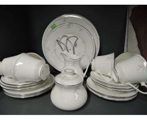 A part tea service by Royal Doulton in the Carnation pattern
